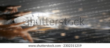 AI singularity. Robotic hand overtake human hands. The moment artificial intelligence exceeds our control and rapidly transforms society resulting in unforeseeable changes to human civilization.