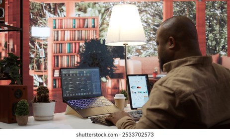 AI software engineer coding modern innovative development project on his gadgets, showcasing machine learning and data processing on neural network. Artificial intelligence business. Camera B.
