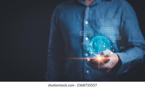 Ai tech, businessman using smartphone show virtual graphic of artificial intelligence chat bot as personal assistant. Using Ai chatbot to generate recommendation, technology transformation. - Shutterstock ID 2368733557
