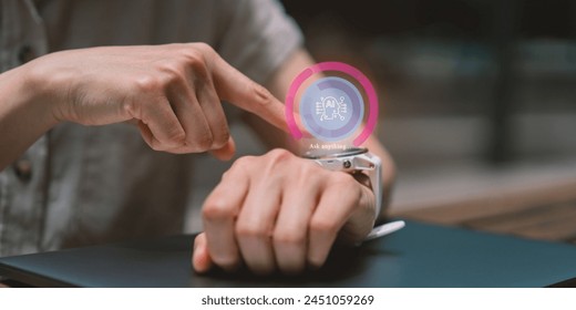 AI tech concept. person's hands using a smartwatch,Interacting with Smartwatch on Wrist, integration of wearable technology. - Powered by Shutterstock