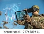 AI technology in the army. Warfare analytic operator using vr virtual reality glasses checking coordination of the military team with tablet device augmented reality operating troops outdoors