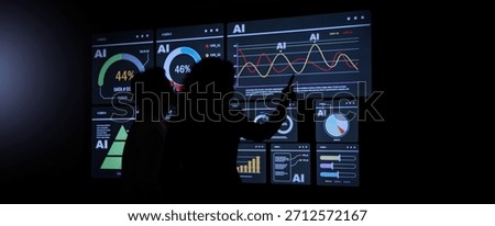 AI Using. Silhouetted analysts interact with a large AI data. AI Display charts graphs and analytics. Business team using futuristic AI interface visuals data. Technology with biz insight and big data
