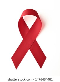 AIDS awareness red ribbon on white background