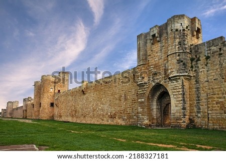 Aigues-Mortes, Gard, Occitania, France: landscape at dawn with the medieval city walls of the town of Camargue

