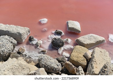 Aigues-Mortes, Salins du Midi salt farm with pink purple salty water