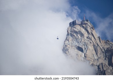 Aiguille Du Midi Cable Car Emerging From The Fog