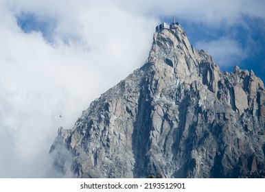 Aiguille Du Midi And Cable Car Emerging From The Fog