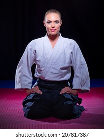 Aikido fighter on black background