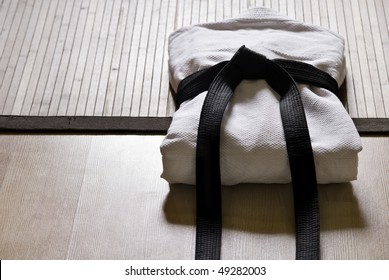 aikido gi with black belt - Powered by Shutterstock