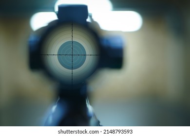 Aiming From A Sniper Rifle At A Target In A Shooting Range.