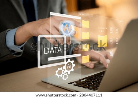 AI-powered data management and digital organization concept. professional using artificial intelligence to store, organize and automate files on a laptop. AI, data, automation, storage, management	