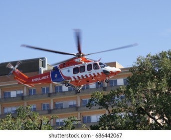Air ambulance takes off from hospital roof.