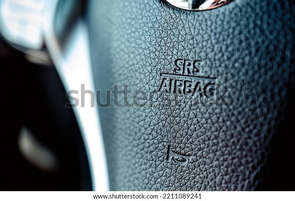 Air\
Bag sign on a steer wheel in the car. Front air\
bags.