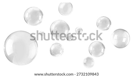 Air bubbles gracefully floating on a white background
