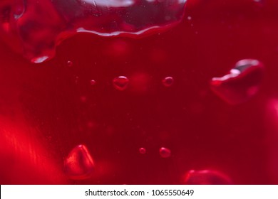 air bubbles in a red jelly. the background of jelly