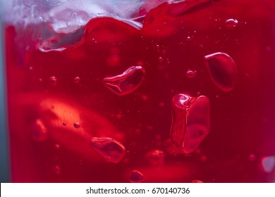 air bubbles in a red jelly. the background of jelly.