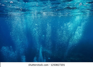 Air bubbles underwater rising to water surface, natural scene, Mediterranean sea, France - Shutterstock ID 1250827201