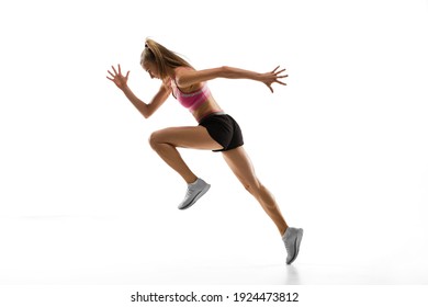 In Air. Caucasian Professional Female Athlete, Runner Training Isolated On White Studio Background. Muscular, Sportive Woman. Concept Of Action, Motion, Youth, Healthy Lifestyle. Copyspace For Ad.