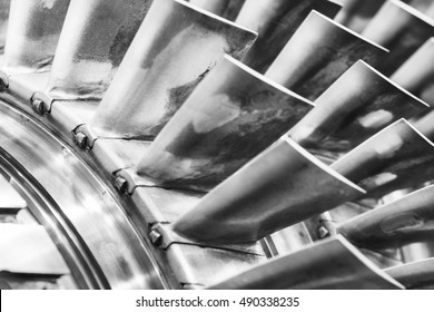 The Air Compressor Of An Aircraft Engine Previously Used. Turbine Blades Closeup. Shallow Depth Of Field.