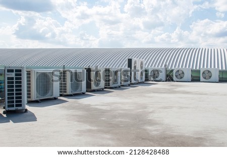 Air compressor on rooftop building