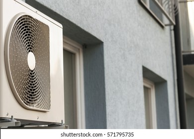 Air condiioners on fasade of reidenial apartmen building.