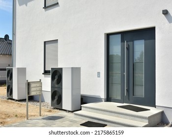 Air conditioner, Air-Air Heat Pump for Heating and hot Water in Front of an Residential Building - Shutterstock ID 2175865159