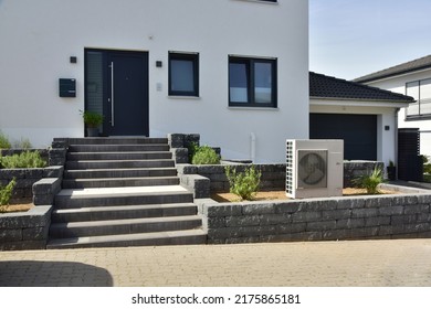 Air conditioner, Air-Air Heat Pump for Heating and hot Water in Front of an Residential Building - Shutterstock ID 2175865181