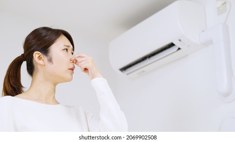 Air Conditioner And Asian Woman