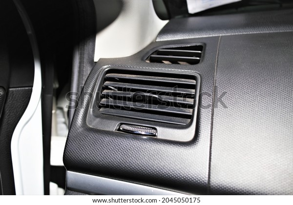 Air\
conditioner in a car, cooling system in a\
car.