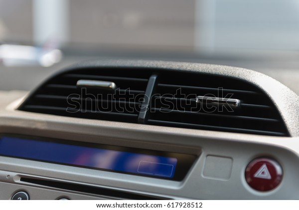 the air\
conditioner of car on blur\
background