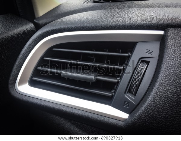 Air\
Conditioner in car and switch on/off\
compartment.