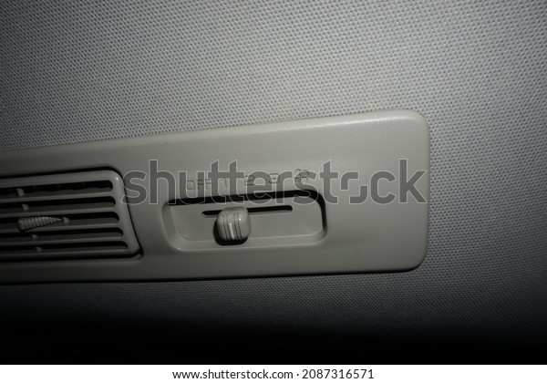air conditioner in car. the turn on and turn\
off buttons on the air\
conditioner.