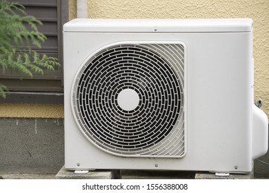 Air conditioner compressor installed on ground - Shutterstock ID 1556388008