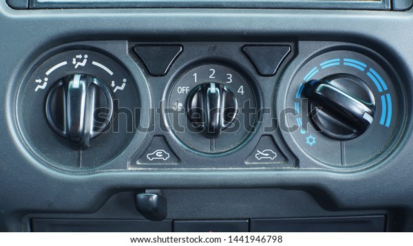 The air\
conditioner control panel in the car.\
