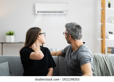 Air Conditioner Couple Sneezing And Having Sore Neck