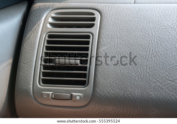 Air Conditioner\
in modern car interior\
detail