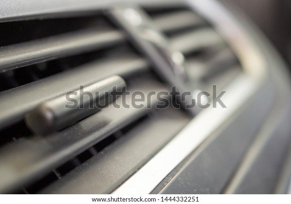 Air\
conditioner in modern compact car close\
up