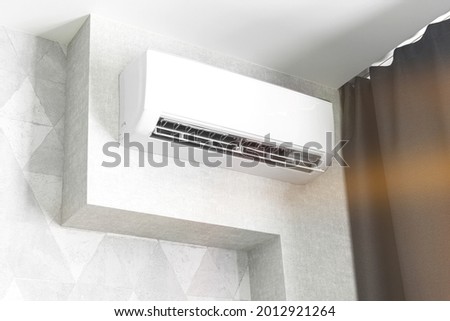 Air conditioner system on white wall living room interior, modern design concept background