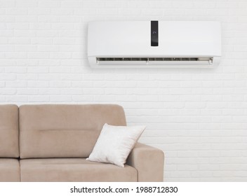 Air Conditioner With Temperature Display Above Sofa In Living Room