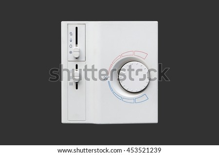 Air conditioner thermostat panel isolated on dark gray background