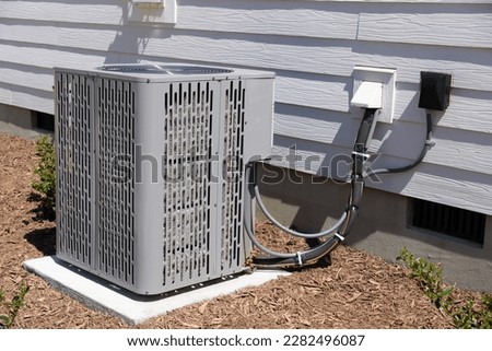 Air Conditioner unit attached to residential property