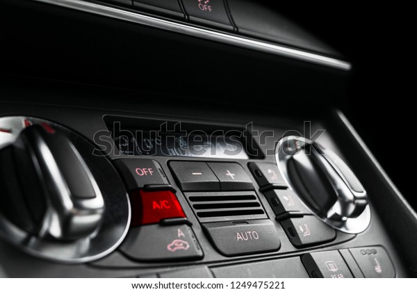 Air conditioning button inside a car. Climate\
control AC unit in the new car. Modern car interior details. Car\
detailing. Vehicle inside