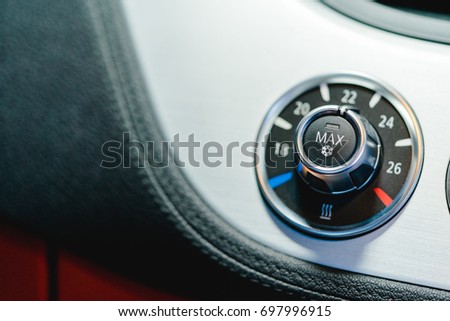air conditioning button inside a super car.