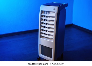 Air conditioning. Mobile air purifier with. Portable conditioner. Cleaning the air in the apartment. Temperature cooling in the room. Concept -  temperature reduction. Mobile air conditioning. - Shutterstock ID 1702552324