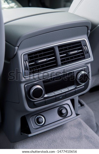 air conditioning in the modern luxury car for\
the rear seat passengers.