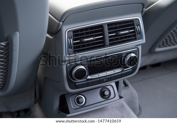 air conditioning in the modern luxury car for\
the rear seat passengers.
