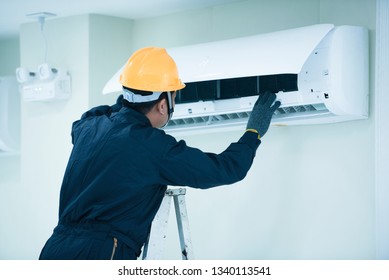 Air conditioning repairman on the wall in the office