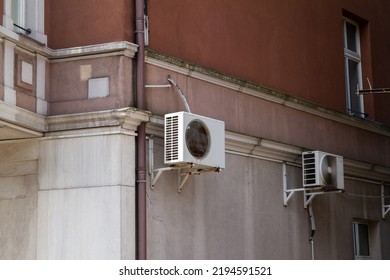 Air Conditioning System, AC Condenser Units Hanging Outside On A Building Wall.