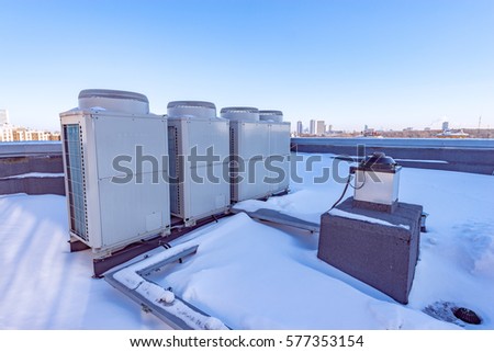 Air conditioning system assembled and installed on top of a building.
