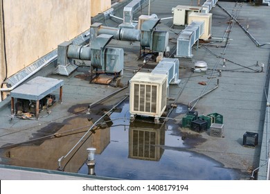 Air Conditioning Systems On Roof Of Commercial Buildings. The Rooftop Location Benefits From Less Noise Pollution, Minimize Dirt And Damage, Increased Security, Space Savings And Ease Of Maintenance